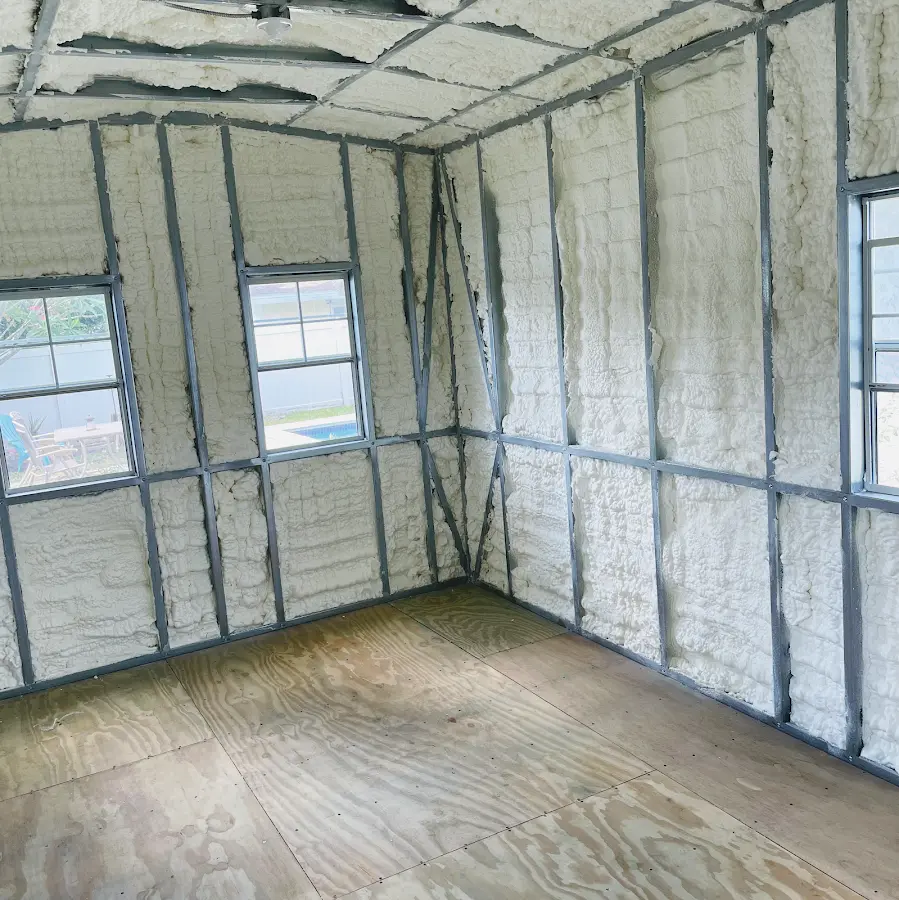Closed-cell spray foam insulation applied to wall cavities in a residential project in Oberlin